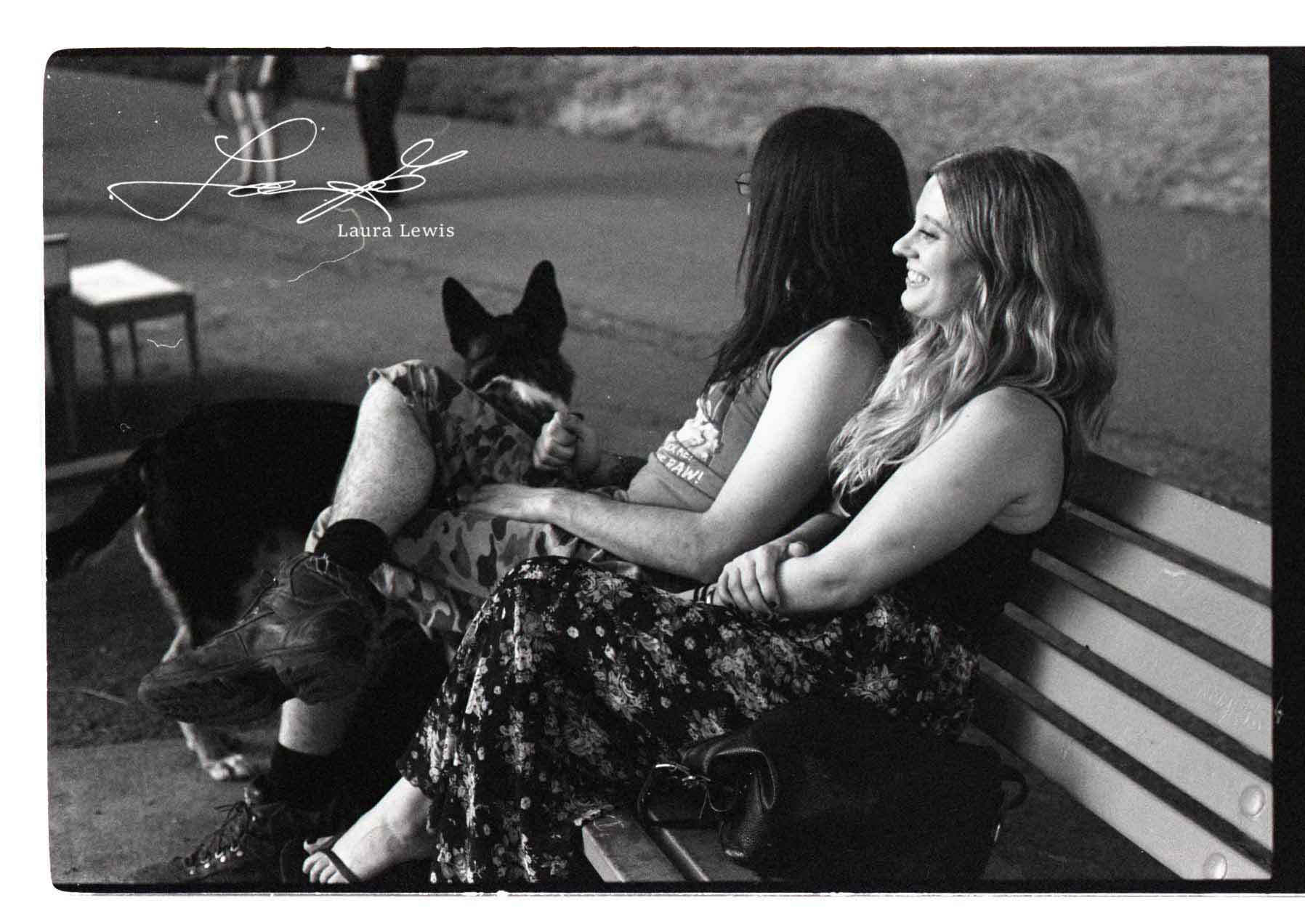 Black-and-white documentary photograph with a dog